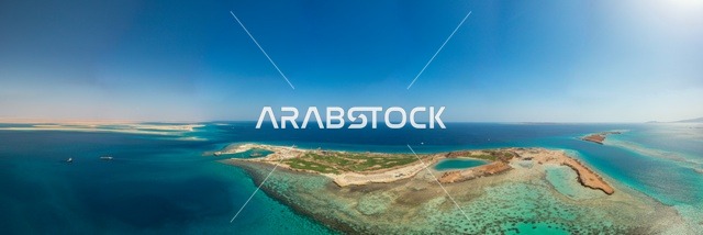 A different island shape, a nature that combines luxury and tranquility, recreational summer activities, the modern design of Sindalah resorts and yacht marinas, the turquoise waters of the Red Sea surround the island with white beaches, an aerial image of Sindalah Island in the NEOM project in northwestern Saudi Arabia.