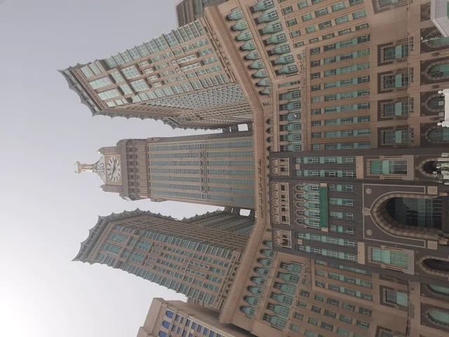 Sacred Islamic religious landmarks, worship and closeness to God, the Royal Clock Tower building in Mecca, the architectural engineering art of modern-style mosques, hotels and towers overlooking the Holy Mosque in the Kingdom of Saudi Arabia.