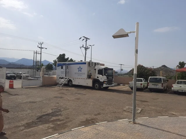 Mobile cars for the healthcare center in the mountainous region of Al-Baha, healthcare services in the Kingdom of Saudi Arabia, preparing and equipping cities in the mountains, peaks, and highlands, famous tourist attractions, sunny weather in the skies of elevated areas.