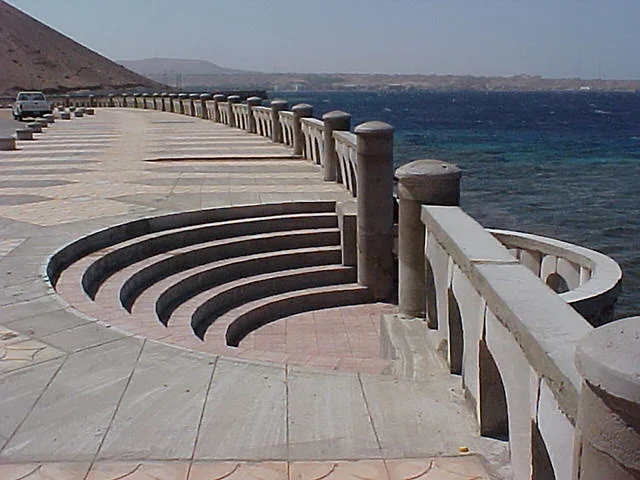 A tourist promenade overlooking the Gulf of Aqaba, the Corniche of the Gulf of Aqaba in the Kingdom of Saudi Arabia, famous landmarks and tourist areas, places for tourism and having a good time in the Kingdom.