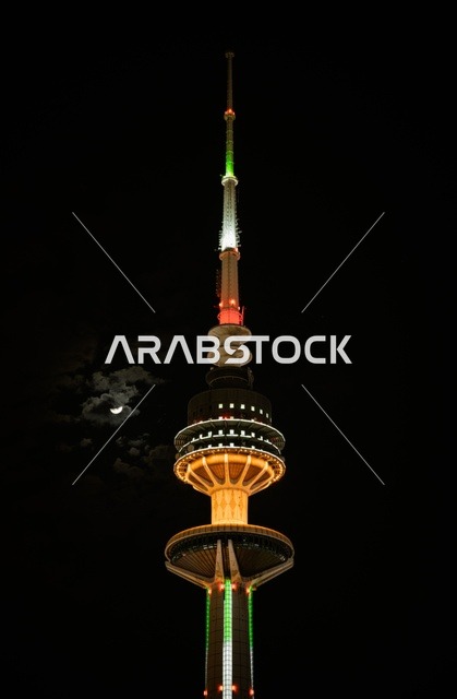 The architectural engineering art of the towers of Kuwait City, skyscrapers and structures on the coast of the Arabian Gulf in the Ras Ajouzah area, the development and urban progress in a modern and advanced style, the green trees and plants, a destination for visitors from all over the world, a famous tourist landmark.