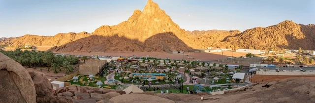 Traditional rural houses at the foot of the Aja Mountains in the village of Aqda, the spirit of the past and the authenticity of the place, nature and greenery with the density of the mountains, landmarks and tourist places in the city of Hail in the Kingdom of Saudi Arabia.