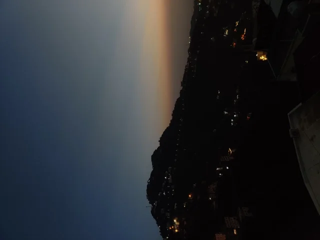 Natural tourist places and landmarks, trees and plants and areas of green nature, agricultural terraces on mountain slopes, the Jebel Fayfa in Jazan in the south of the Kingdom of Saudi Arabia, peaks and rocky elevations, the atmosphere at night in elevated areas, houses and residential buildings.