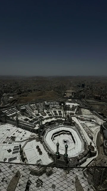 The Sacred House of God in the Holy Mosque in Mecca, Saudi Arabia, performing the rituals of Hajj and Umrah, worship and drawing closer to God, the Qibla of Islam and Muslims, an aerial view of the pilgrims and Umrah performers circling around the Holy Kaaba in Mecca.