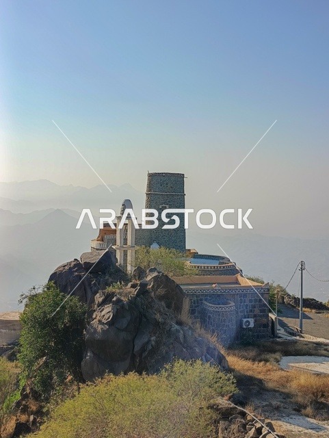 Old houses on the slopes of the Al-Fifa Mountains, green plants and trees, the Al-Fifa Mountains in Jazan, southern Saudi Arabia, famous tourist spots in Saudi Arabia, mountains and highlands, the natural backdrop in Jazan.