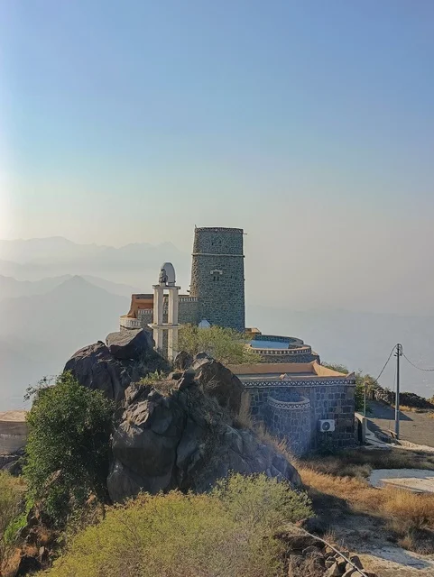 Old houses on the slopes of the Al-Fifa Mountains, green plants and trees, the Al-Fifa Mountains in Jazan, southern Saudi Arabia, famous tourist spots in Saudi Arabia, mountains and highlands, the natural backdrop in Jazan.