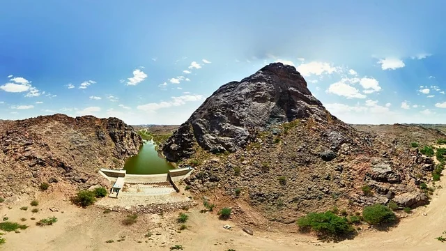 Historical archaeological landmarks in the Kingdom of Saudi Arabia, a panoramic image of Wadi Al-Musayriq and the Khursani Dam amidst the mountains in southern Khaybar, Asir region, geological nature, peaks, highlands, and terrain, natural background.