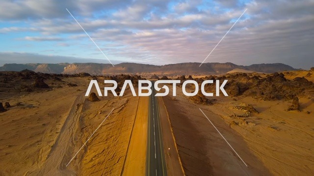 تصوير درون جوي لطريق مستقيم فى مدائن صالح بمحافظة العلا في المملكة العربية السعودية، الطبيعة الصحراوية، مدينة العلا التراثية، قلاع العلا التاريخية، قيادة عبر الصحراء وقت الغروب ، معالم تاريخية أثرية قديمة
