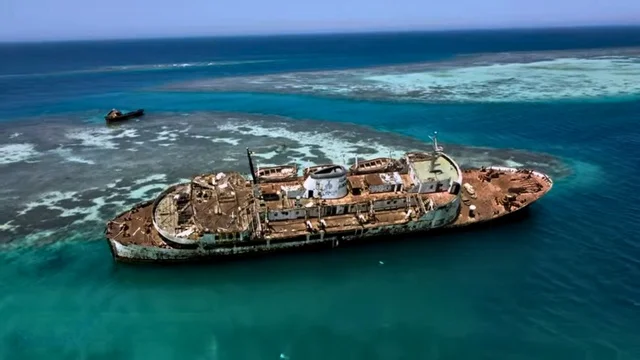 Aerial image of the abandoned Al-Fahd shipwreck in the Red Sea off the coast of Al-Shuaiba, Jeddah city in the Kingdom of Saudi Arabia, tourism in Saudi Arabia, Jeddah sky, nature in Jeddah.