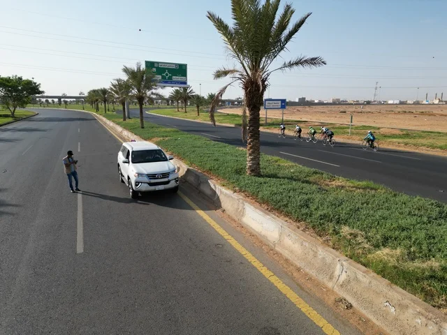 Natural landmarks in the city of Tabuk, cycling events and races, various physical activities, traffic of cars on streets and paved roads, famous tourist attractions in the Kingdom of Saudi Arabia, maintaining health and physical fitness.