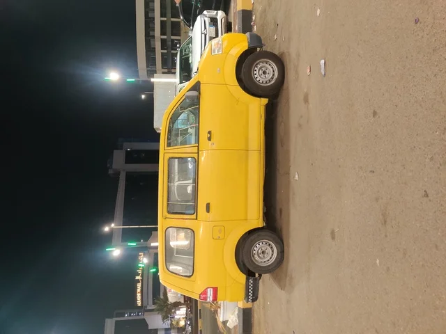 A yellow car in one of the streets of Jazan in the south of the Kingdom of Saudi Arabia, modern land transportation, unique brands of luxury cars.