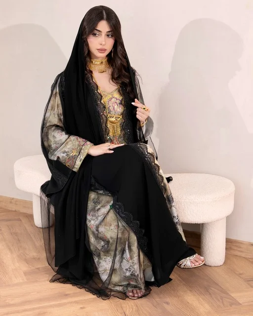 The concept of elegance, femininity, and chicness, modern contemporary fashion, attention to external appearance, a Gulf Arab Saudi woman wearing a luxurious abaya with lace and crystal details along with a shawl adorned with scattered gems, a collection of luxurious abayas.