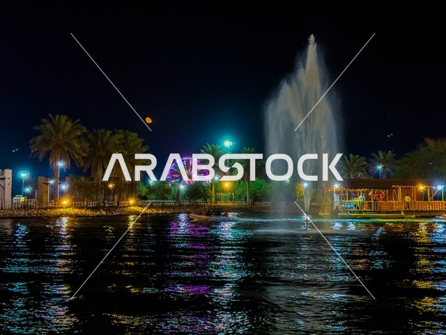 بحيرة منتزه مدينة جواثا في منطقة الاحساء في الليل, الحدائق والمنتزهات الترفيهية, المعالم والأماكن السياحية الطبيعية المشهورة في المملكة العربية السعودية, جذب واستقطاب السياح من جميع أنحاء العالم, الاهتمام بزراعة الأشجار والنباتات الخضراء