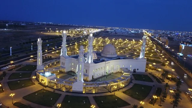 The designs and decorations of domes and minarets, the famous Islamic religious landmarks and places in the Kingdom of Saudi Arabia, the Parents Mosque in the city of Tabuk at night, the architectural engineering art of building mosques in the Arab Islamic style.