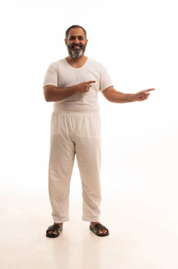 Specifying a certain location, indicating and clarifying something, pointing to the location of an element, a portrait of an Arab Saudi Gulf man wearing white pants and a t-shirt, pointing with his hand to the side, full body, white background.