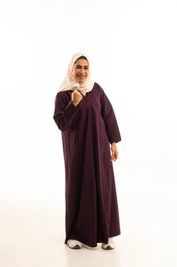 A portrait of a Saudi Arabian Gulf woman wearing a hijab and an abaya, making gestures and facial expressions with her hands that indicate happiness, victory, strength, triumph, and encouragement, full-body, with a white background.