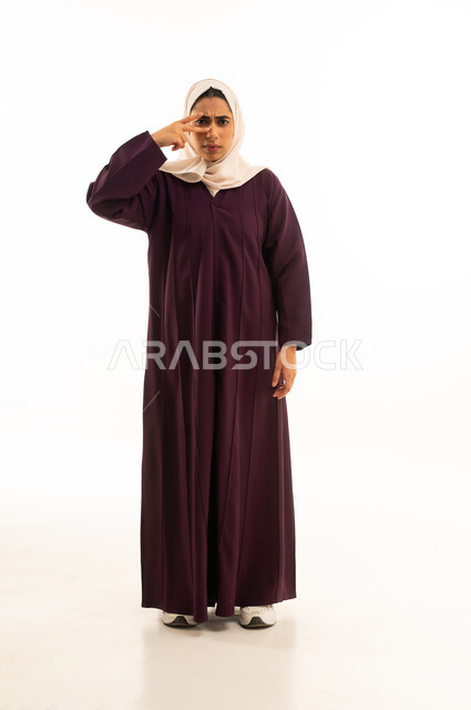 A peeking attempt, a portrait of a Saudi Arabian Gulf Arab woman in a hijab wearing an abaya covering her face with her hand, a peeking attempt, full body, white background.