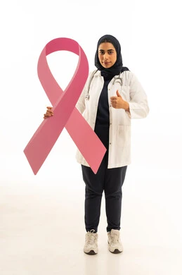 Admiration for the logo of the global campaign to challenge malignant diseases, a side portrait of a Saudi Arabian Gulf woman wearing a hijab and casual attire holding the logo of the global campaign in her hands, with a white background.