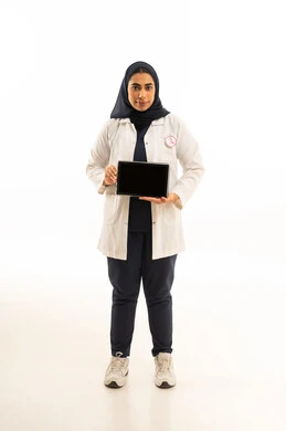 A portrait of a Saudi Arabian Gulf woman wearing a hijab in casual attire, displaying a black screen on a tablet with the awareness slogan for early breast cancer detection, on World Cancer Awareness Day, full-body shot, white background.
