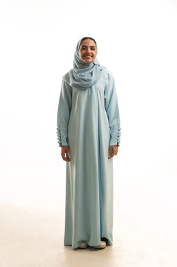 1766034756FvStanding upright and poised, the concept of femininity and self-confidence, attention to elegance and outward appearance, portrait of a smiling, veiled young Arab woman from the Gulf region of Saudi Arabia, wearing an abaya and looking with gestures of happiness and joy, taking a personal photograph for official documents, full body length, white backgroundQYrFLRxM