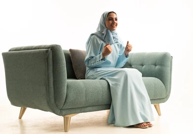 Achieving goals and success, the concept of joy in victory and winning, a portrait of a smiling Saudi Gulf woman in a hijab raising her hands in gestures of enthusiasm, gestures of happiness and joy, with a white background. Achieving goals and success, the concept of joy in victory and winning, a portrait of a smiling Saudi Gulf woman in a hijab raising her hands in gestures of enthusiasm, gestures of happiness and joy, with a white background.