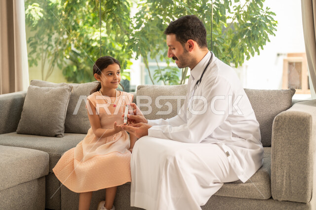 A Saudi Arabian Gulf Arab doctor wearing a medical coat is pricking the finger of a girl, a Saudi girl suffering from a chronic medical condition, using electronic devices for home testing, regular follow-ups for diabetes patients, and quick medical tests to determine blood sugar levels.
