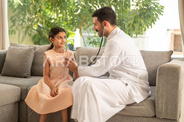 Working in the healthcare sector in Saudi Arabia involves providing healthcare and caring for patients. An Arab Gulf Saudi doctor wearing traditional attire is examining a girl using an otoscope at home, using a stethoscope to listen to heartbeats.