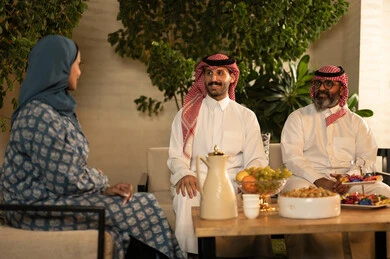 Enjoying happy family gatherings filled with love, the atmosphere of family in Saudi society during holidays and Islamic occasions, an Arab Gulf Saudi family enjoying friendly conversations, the concept of family bonding.