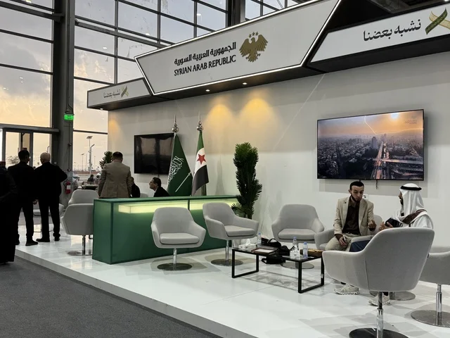 A pavilion for Syrian businessmen at the "Made in Saudi Arabia 2025" exhibition, a prominent industrial event aimed at enhancing Saudi national services, showcasing the quality and diversity of national industries and their innovations. The exhibition carries the slogan "We Empower Manufacturing," organized by the Saudi Export Development Authority, 2025 at the Riyadh Exhibition Center.
