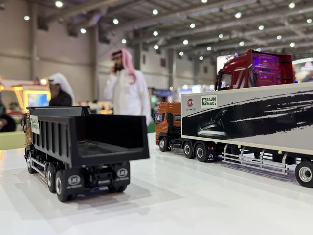 Models of Saudi manufacturing trucks at the "Made in Saudi Arabia 2025" exhibition, a prominent industrial event aimed at enhancing Saudi national services, showcasing the quality and diversity of national industries and their innovations. The exhibition carries the slogan "We Empower Manufacturing," organized by the Saudi Export Development Authority, 2025 at the Riyadh Exhibition Center.