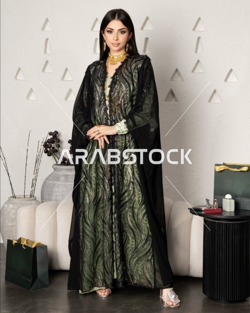 Modern women's fashion, the concept of beauty, elegance, and attention to appearance, a Gulf Arab Saudi woman wearing a black embroidered abaya made of chiffon and lace in a modern style.