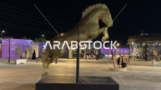 تمثال حصان باللون الذهبي في يوم التطوع، مناسبة لشكر المتطوعين على جهودهم والتوعية بمساهماتهم في المجتمع، المملكة العربية السعودية، يوم التطوع العالمي 2025 في مركز الملك عبد العزيز الثقافي العالمي (إثراء)، زيادة الوعي العام حول أهمية العمل التطوعي في التنمية الاجتماعية