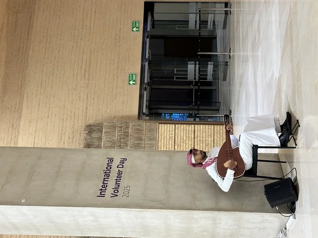 Integrating musical heritage (oud) into cultural atmospheres to raise public awareness of the importance of social contributions, World Volunteer Day 2025 at the King Abdulaziz Center for World Culture (Ithra), Kingdom of Saudi Arabia.