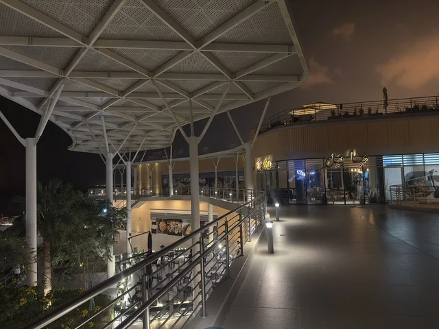 A classy coffee shop in The Move complex in Jubail Industrial City in the Eastern Province, a modern entertainment destination, a complete shopping and entertainment experience, modern facilities for families and youth, a vibrant atmosphere for 2025.