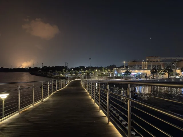 A promenade in The Move complex in Jubail Industrial City in the Eastern Province, a complete shopping and entertainment experience, a modern entertainment destination for the Jubail Corniche, cafes and restaurants for families and youth, a vibrant atmosphere for the year 2025.