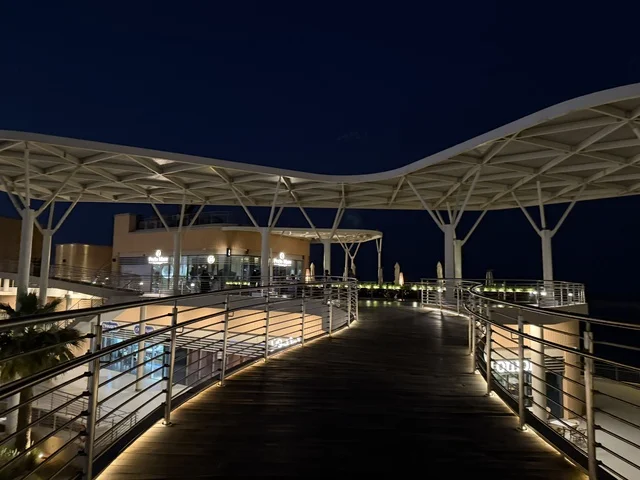 A promenade in The Move complex in the city of Jubail Industrial in the Eastern Province, a complete entertainment and commercial landmark, cafes and restaurants for families and youth, a modern entertainment destination for the Jubail Corniche, a vibrant atmosphere for the year 2025.