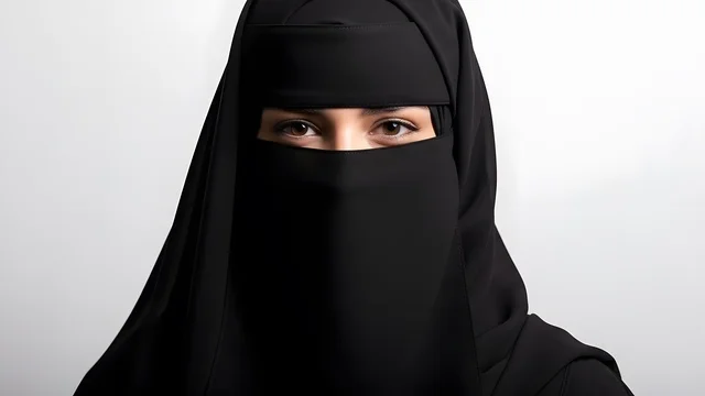 The concept of beauty and femininity, a Saudi Arabian Gulf woman in a niqab wearing a black abaya, standing upright and confidently, modesty and decency, a Muslim woman, a photoshoot, a Saudi girl, white background.