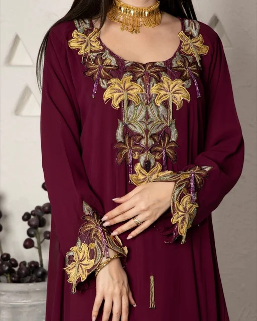 Gold jewelry and accessories, wearing a modern women's outfit, a Saudi Gulf Arab woman wearing an embroidered abaya, beauty, elegance, and attention to external appearance. Gold jewelry and accessories, wearing a modern women's outfit, a Saudi Gulf Arab woman wearing an embroidered abaya, beauty, elegance, and attention to external appearance.