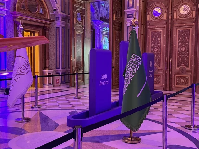 The flag of the Kingdom of Saudi Arabia stands tall, efforts are combined to succeed in the Kingdom's vision in the business sector, flags of countries and partners, the Entrepreneurship Forum and Modern Work Patterns (DeveGo 2025) at the King Abdulaziz International Conference Center in Riyadh, from December 21 to 23, 2025.