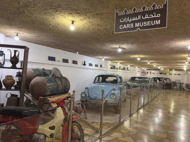 The car museum introduces the types of vintage cars on display. The heritage village is a prominent museum and restaurant located on the Corniche of Dammam in the Kingdom of Saudi Arabia, set in a rural or historical environment.