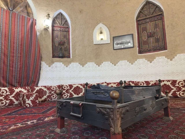 The traditional indoor seating called the Najdi Village, a rural or historical environment, preserves local heritage and showcases it to visitors. The popular heritage village is a prominent museum and restaurant located on the Corniche of Dammam in the Kingdom of Saudi Arabia.