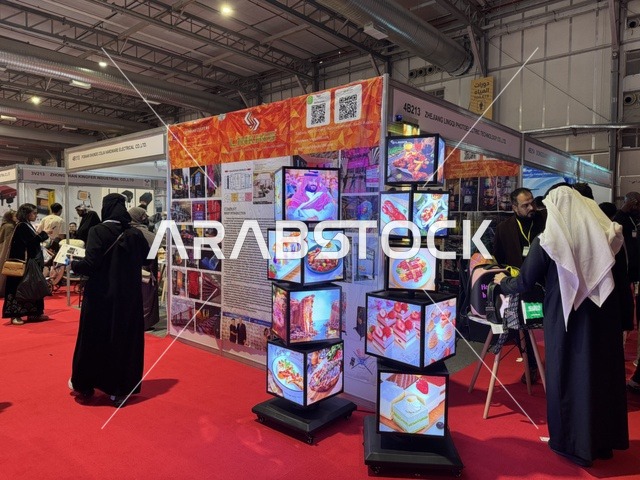 Rotating display holder at the international trade fair China Homelife Saudi Arabia Expo on December 24, 2025, in Riyadh, Saudi Arabia, connecting Chinese suppliers with the Saudi market, diverse Chinese products, import and supply opportunities, business and investment partnerships.
