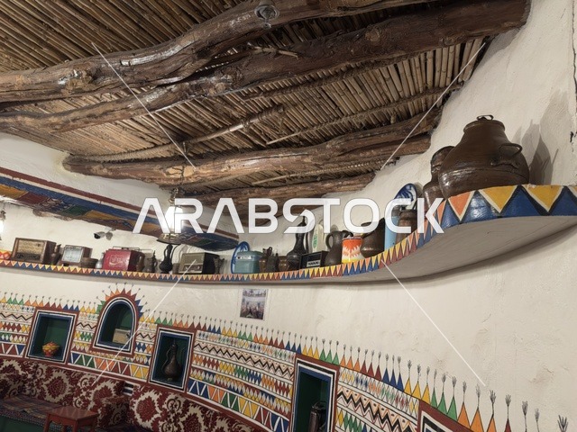 Low and comfortable seats covered with patterned fabrics, an interior design that reflects Arab heritage. This type of place is called "Majlis." The village is designed to reflect the traditional architecture of the region. The heritage village is a prominent museum and restaurant located on the Corniche of Dammam in the Kingdom of Saudi Arabia.
