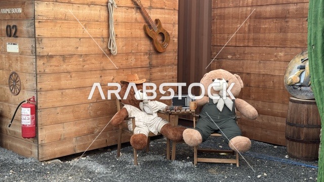 Southwest Town (Cowboy) in Al-Zahra neighborhood on King Abdulaziz Road in Jeddah in 2025, wearing American cowboy attire, a place to have a good time in the Kingdom of Saudi Arabia, buildings in classic Western style.