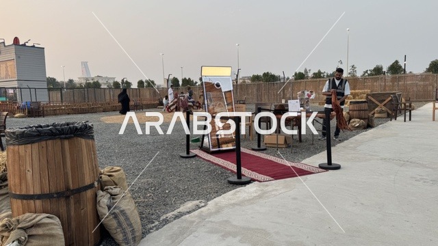 Southwest Town (Cowboy) in Al-Zahra neighborhood on King Abdulaziz Road in Jeddah in 2025, wearing American cowboy attire, a place to have a good time in the Kingdom of Saudi Arabia, buildings in classic Western style.