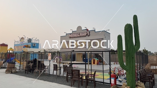Southwest Town (Cowboy) in Al-Zahra neighborhood on King Abdulaziz Road in Jeddah in 2025, wearing American cowboy attire, a place to have a good time in the Kingdom of Saudi Arabia, buildings in classic Western style.