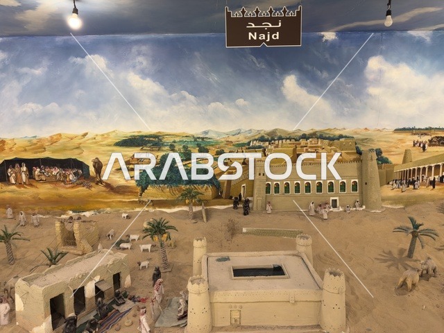 A colorful mural of the Najd region in the Heritage Village on the Corniche of Dammam, a cultural and tourist landmark that combines heritage, restaurants, and cafes, a place to spend enjoyable time with family in the Kingdom of Saudi Arabia.