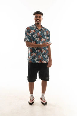 The palm of the hand is directed upwards as a sign of introducing something, an Arab Gulf Omani man wearing casual attire, gestures of happiness and joy, portrait with a white background, full body.