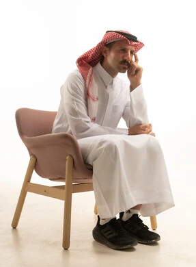 Saudi Man in Traditional Dress Sitting in Studio