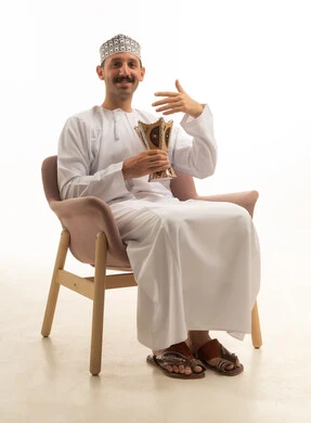 Saudi Man in Traditional Dress with Incense Burner